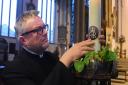 Head Verger, Chris Sanham, at St Peter Mancroft where the candles have been lit in memory of Her Majesty Queen Elizabeth II.