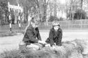 Two girls pictured Caister in April 1961, where they seem to be catching tadpoles or other aquatic wildlife.