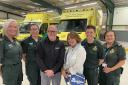 Chris and Lesley Geddes with the life-saving Secamb team