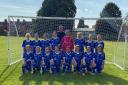 The Exmouth U12 Girls squad with new team sponsor Scott Gray