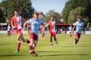 Taunton's Tom Smith scored a second-half hat trick against Poole Town to send his team through to the next round of the cup