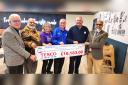 Tesco Burnley community champion, Mukhtar Mirza, at the cheque presentation