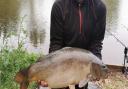 John Selley with a double figure Mirror Carp from Newbarn Angling Centre