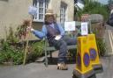 A scarecrow with a message at a previous festival