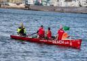 An Exmouth Rowing Club crew being oput through their paces off shore. Picture LES NORCLIFFE