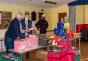 Budleigh Lions Club members making hampers for struggling families in the town