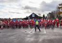 Participants dressed as Santa set off from Topsham Rugby Club.