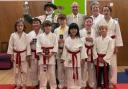 Town Crier Roger Bourgei with Judo Master John Goldman, his daughter Ruth Goldman, and some of the club members who received awards