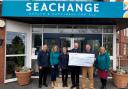 Exmouth Town Concert Band presented a cheque to Seachange Budleigh, Marc Jobson.