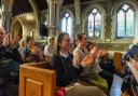 The crowd at Budleigh Salterton Literary festival applaud their next speaker.