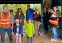 Volunteers helping draw art on the Phear Park shelter.