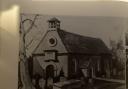 Old photo of St Michael’s and All Angels Church with Sir John's tomb in the foreground