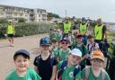 Lions Richard, Tom and Steve with St Peter's School pupils at a beach clean