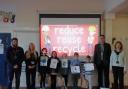 Lions Richard and Sue, and Jessica from Suez  Recycling and Recovery, with pupils at the special school assembly