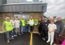 The Lions presenting their £2,000 cheque for training nets and a defibrillator at Budleigh Salterton Cricket Club