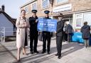 Alison Hernandez and police officers at official opening of front desk at Honiton Police Station