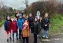 Smiling despite the rain - the under-8s team on their sponsored walk