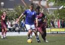 Exmouth's Merson Ham shields the ball from Leighton Thomas