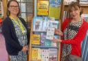 Beatrice Drecq, senior supervisor at Exmouth Library, with Gina Awad and the display of dementia support books