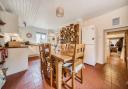 The kitchen/breakfast room has a farmhouse-style look to it