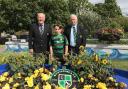 (left to right) Peter Farley, Lewis Gale, Dave Josey and the floral tribute