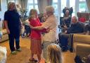 Molly dancing with a resident during her visit