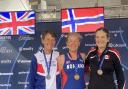 Jenny Reay on the podium with her World Masters W65 5,000m Silver Medal