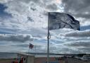 Exmouth's blue flag above seafront.