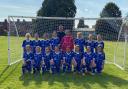 The Exmouth U12 Girls squad with new team sponsor Scott Gray