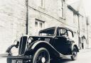 A vintage car in front of the Archway building in Axminster.