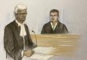 Court artist drawing by Elizabeth Cook of prosecution barrister Kannan Siva (left) with Pc Matthew Tregale, of Exeter, Devon, at Bristol Crown Court where he is charged with 12 offences relating to three women and sexual activity with a child. Picture