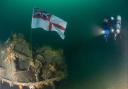 The white ensign planted on HMS Exmouth.