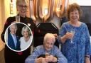 Doris celebrating her 100th with glass of fizz and a royal telegram from the King