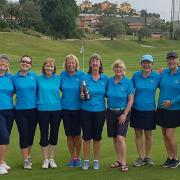 From left: Sue Loynes, Sue Harrison, Sally Underwood, Jo Goldsworthy, Nina Hawkins, Team Captain Sue Burley, Helen Chivers, Jenny Dobel, Sarah Jones, Dennis Chivers (caddy)