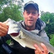 Damion Fryer with a Surprise River Otter Bass