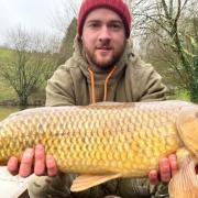 Liam O'Connor with a common carp from Newbarn