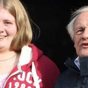 Robin Waller, who has died aged 73, pictured receiving his honorary membership of Exmouth Carnival, with granddaughter Cassara.