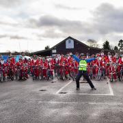 Participants dressed as Santa set off from Topsham Rugby Club.