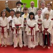 Town Crier Roger Bourgei with Judo Master John Goldman, his daughter Ruth Goldman, and some of the club members who received awards