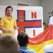 RNLI staff teaching South West kids about beach safety as a part of their ‘Meet the Lifeguard’ programme.