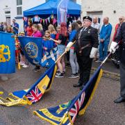 Saluting the flags at the Festival of Thanks