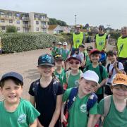 Lions Richard, Tom and Steve with St Peter's School pupils at a beach clean