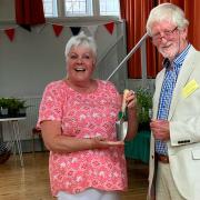 Jo Vanstone receiving her trowel from the Flowe Show chair, Bob Wiltshire