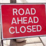 Sign indication that road ahead is closed on the street