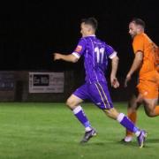 Exmouth's Ben Steer has the beating of Bemerton's Harry Lander