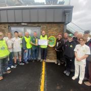 The Lions presenting their £2,000 cheque for training nets and a defibrillator at Budleigh Salterton Cricket Club