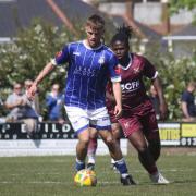 Exmouth's Merson Ham shields the ball from Leighton Thomas