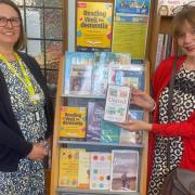 Beatrice Drecq, senior supervisor at Exmouth Library, with Gina Awad and the display of dementia support books