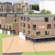 Plans for a new 65-bed hotel and 66 new homes was rejected in an at-times tense debate.