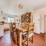 The kitchen/breakfast room has a farmhouse-style look to it